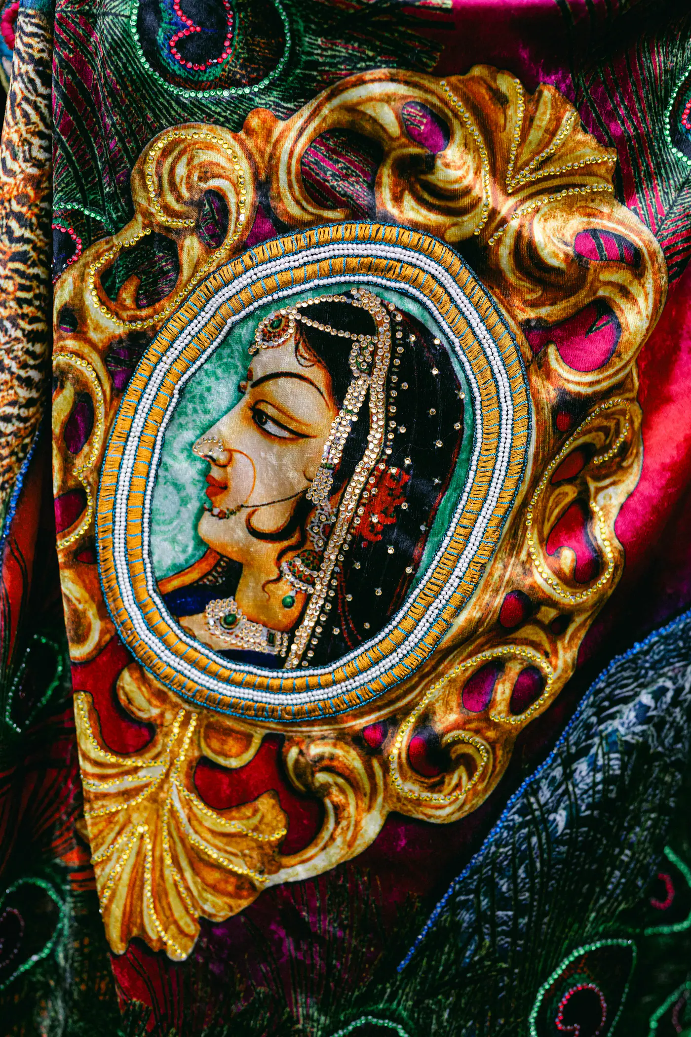 Embroidered velvet bag with a painted portrait of an Indian bride