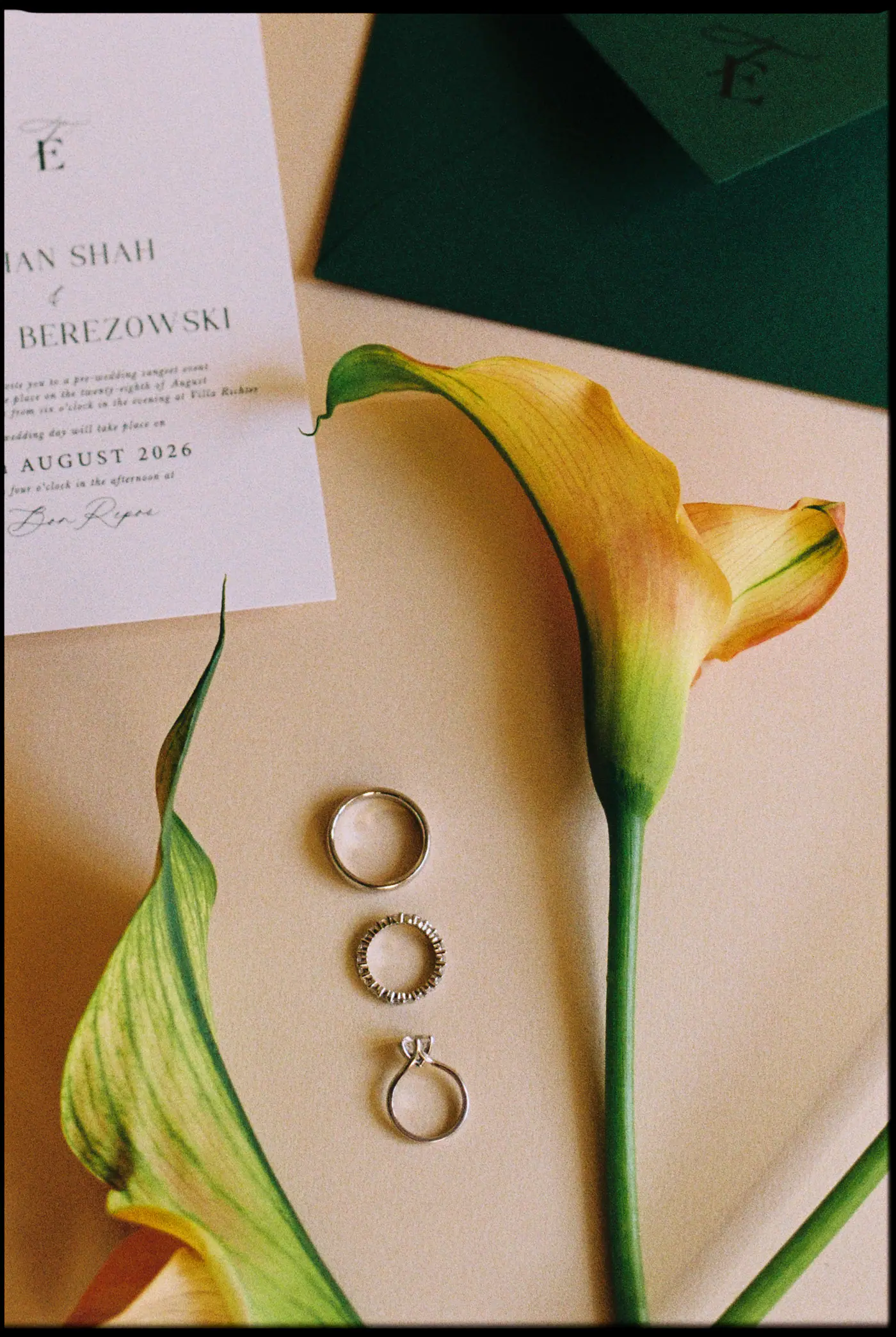 Wedding invitation, three rings and a yellow calla lily