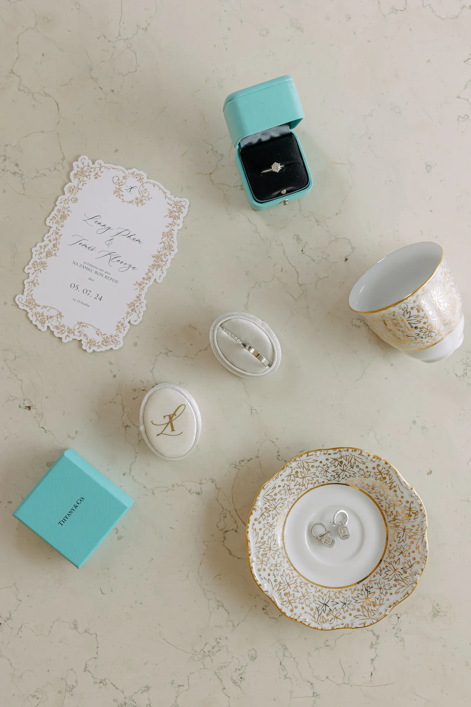 Wedding details: a Tiffany box, ring, invitation and porcelain